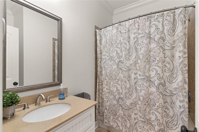 full bath featuring vanity and ornamental molding