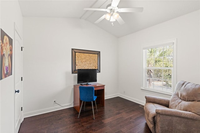 office area featuring vaulted ceiling, a ceiling fan, baseboards, and dark wood-style flooring