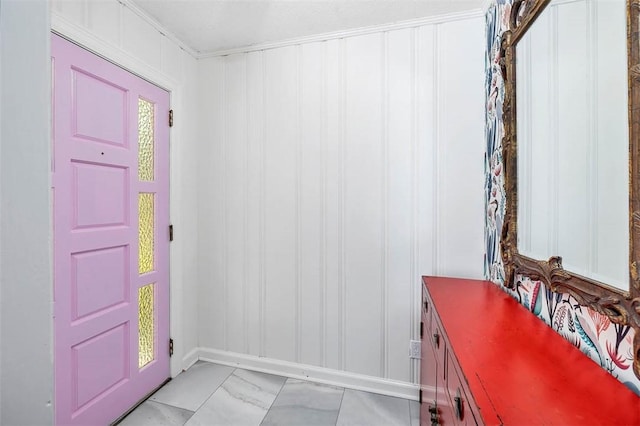 entryway featuring marble finish floor and a decorative wall