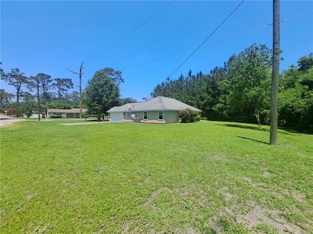 1002 Baltimore Ave, Waycross, GA 31501 - view of green lawn with a garage