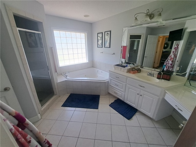 1002 Baltimore Ave, Waycross, GA 31501 - full bath with vanity, a bath, tile patterned floors, and a shower stall