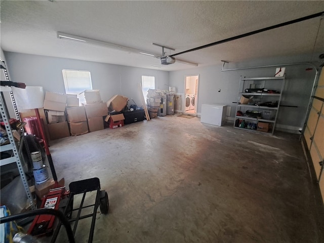 1002 Baltimore Ave, Waycross, GA 31501 - garage with a garage door opener, washer and clothes dryer, and electric water heater