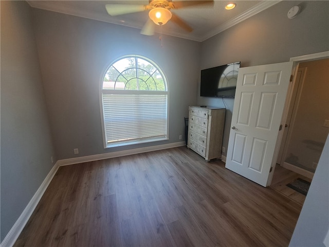 1002 Baltimore Ave, Waycross, GA 31501 - unfurnished bedroom featuring crown molding, baseboards, dark wood-type flooring, recessed lighting, and ceiling fan