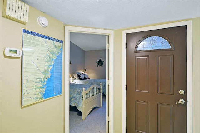 874 Wimbledon Dr, Saint Simons Island, GA 31522 - carpeted entrance foyer with a textured ceiling