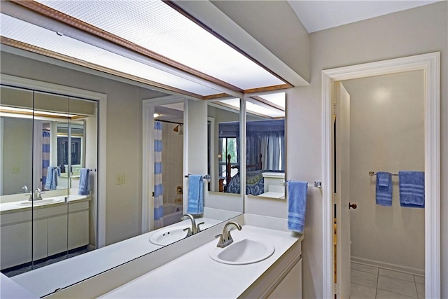 874 Wimbledon Dr, Saint Simons Island, GA 31522 - bathroom with vanity, tile patterned flooring, shower / bath combo, and baseboards
