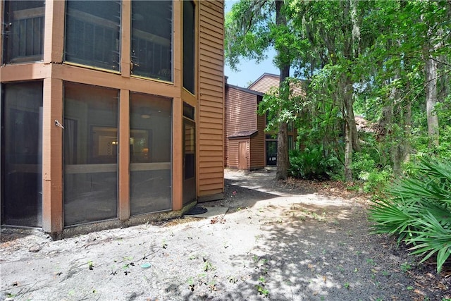 874 Wimbledon Dr, Saint Simons Island, GA 31522 - view of property exterior featuring a sunroom