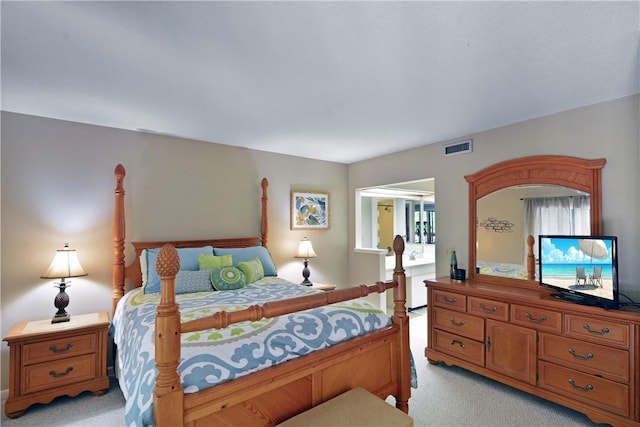 874 Wimbledon Dr, Saint Simons Island, GA 31522 - bedroom featuring light colored carpet and multiple windows