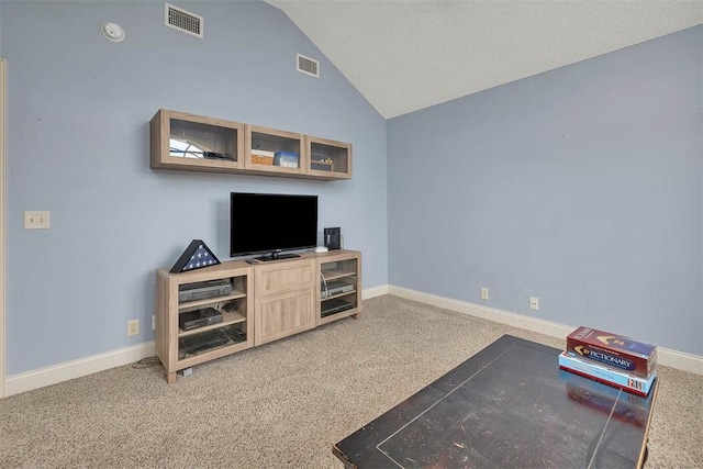 living area featuring baseboards, visible vents, and vaulted ceiling