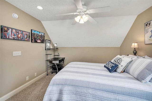 carpeted bedroom featuring lofted ceiling, a ceiling fan, baseboards, and a textured ceiling