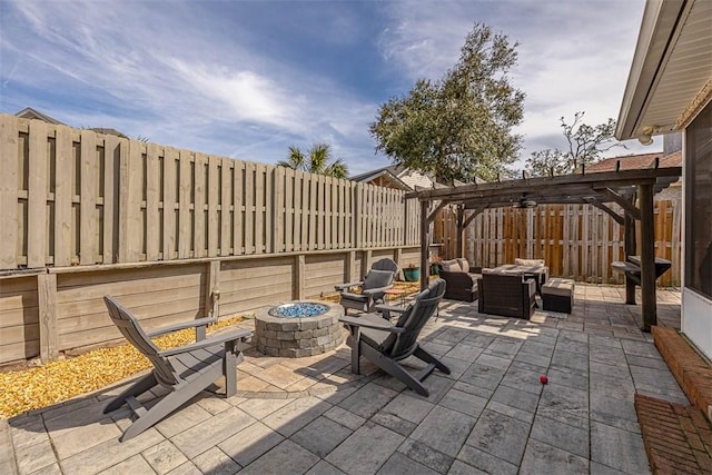 view of patio with an outdoor living space with a fire pit, a fenced backyard, and a pergola