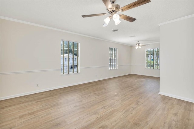 239 Georgia St, Saint Simons Island, GA 31522 - spare room featuring ornamental molding, light wood-type flooring, a ceiling fan, and a textured ceiling