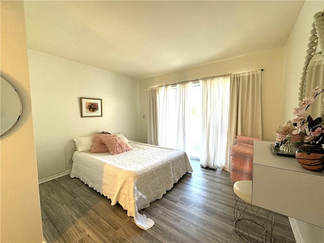 bedroom featuring dark hardwood / wood-style flooring