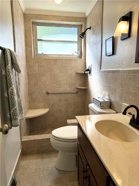 bathroom featuring tile patterned floors, toilet, ornamental molding, and a tile shower