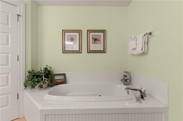 bathroom with tiled tub