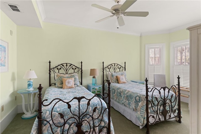 bedroom with ornamental molding, carpet flooring, and ceiling fan