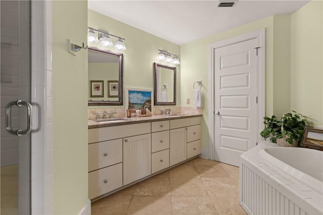 bathroom featuring vanity, tile patterned floors, and independent shower and bath