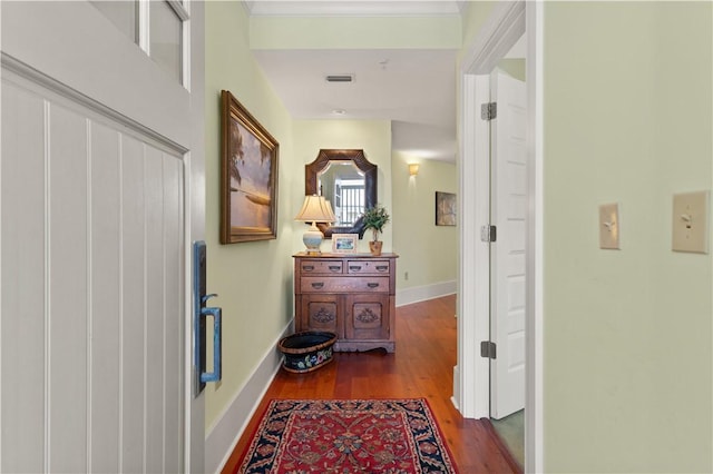 hall with hardwood / wood-style floors