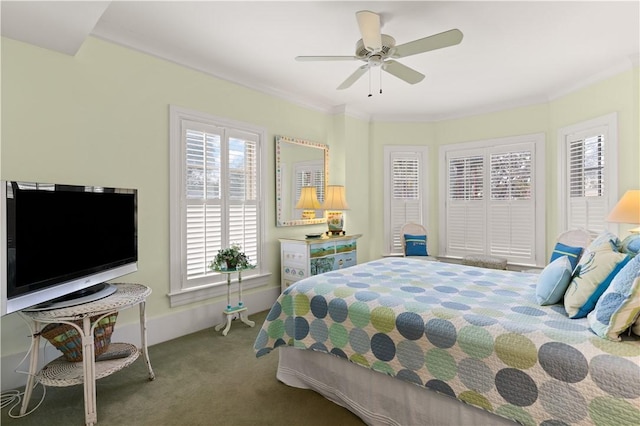 bedroom with ornamental molding, carpet, and ceiling fan