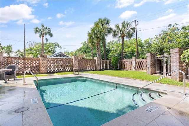 view of swimming pool featuring a patio area