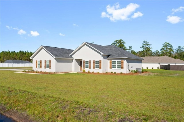 view of front facade featuring cooling unit and a front lawn