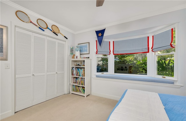 122 Saint Andrews Dr, Saint Simons Island, GA 31522 - bedroom with carpet, ornamental molding, a closet, and ceiling fan