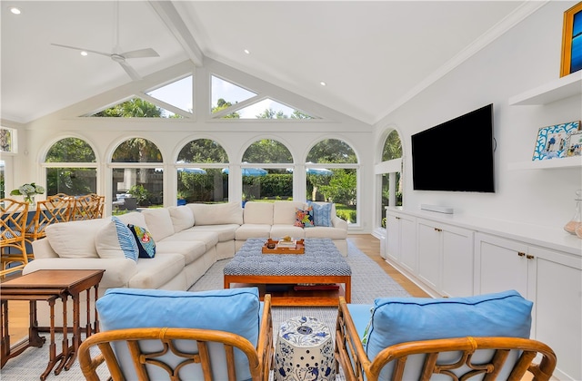 122 Saint Andrews Dr, Saint Simons Island, GA 31522 - living room with healthy amount of natural light, beamed ceiling, a ceiling fan, light wood finished floors, and high vaulted ceiling