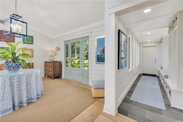 122 Saint Andrews Dr, Saint Simons Island, GA 31522 - foyer entrance with a chandelier, crown molding, recessed lighting, and vaulted ceiling