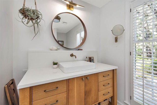 bathroom with visible vents and vanity