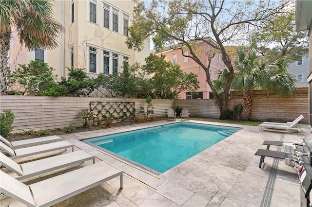 view of swimming pool featuring a patio area