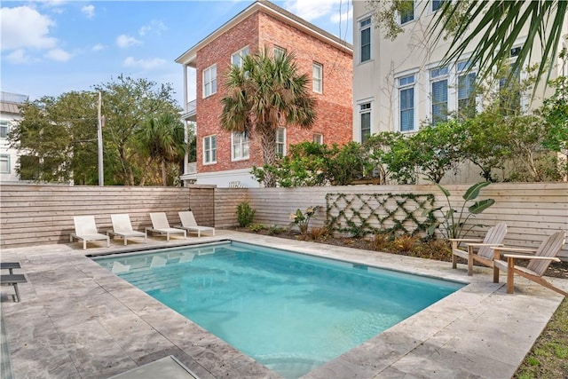 view of swimming pool featuring a patio