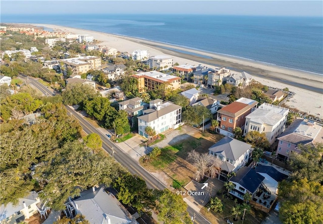 aerial view featuring a view of the beach and a water view