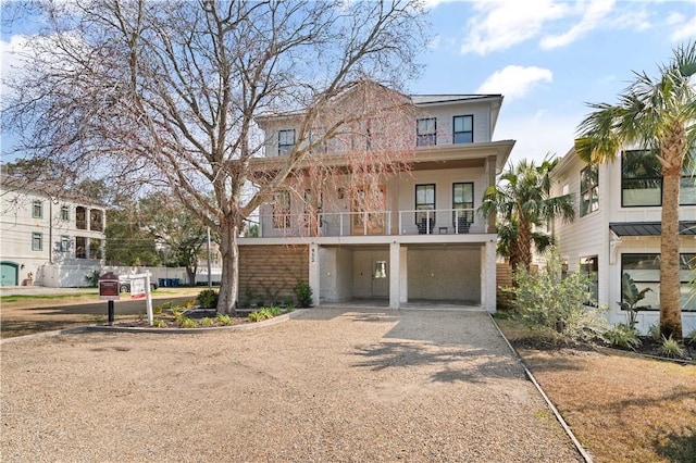 view of front of home featuring a balcony