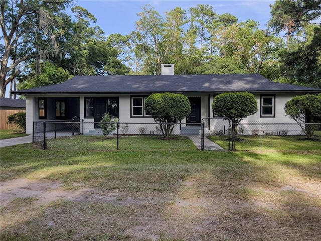 4166 Southern Rd, Brunswick, GA 31520 - ranch-style house featuring a fenced front yard, a chimney, and a shingled roof