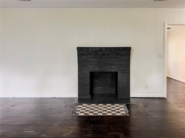4166 Southern Rd, Brunswick, GA 31520 - detailed view of wood finished floors, crown molding, and a fireplace with flush hearth