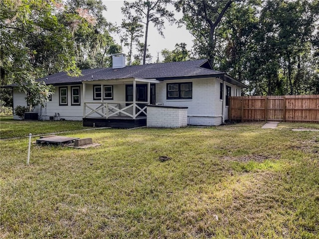4166 Southern Rd, Brunswick, GA 31520 - back of property featuring a chimney and a shingled roof