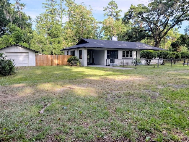 4166 Southern Rd, Brunswick, GA 31520 - ranch-style home featuring a detached garage, an outbuilding, and a chimney