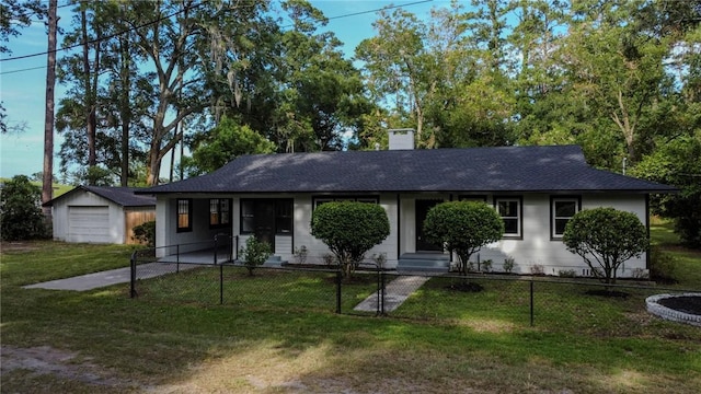 4166 Southern Rd, Brunswick, GA 31520 - ranch-style home featuring an outdoor structure, a chimney, a shingled roof, and a garage
