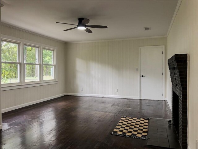 4166 Southern Rd, Brunswick, GA 31520 - unfurnished room featuring a ceiling fan, a brick fireplace, crown molding, and wood finished floors