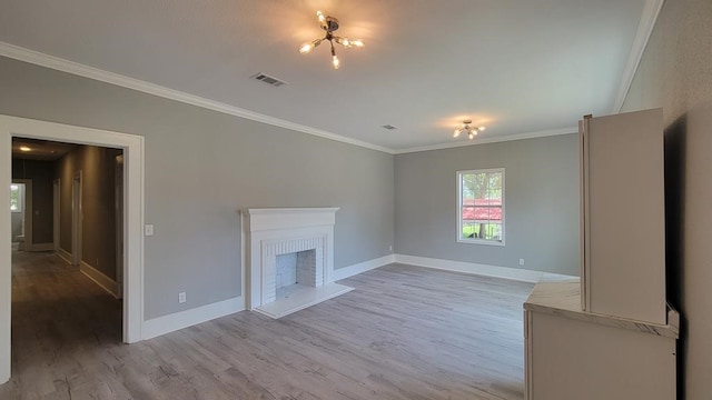506 Ware St, Waycross, GA 31501 - unfurnished living room featuring ornamental molding, light wood-type flooring, and a fireplace