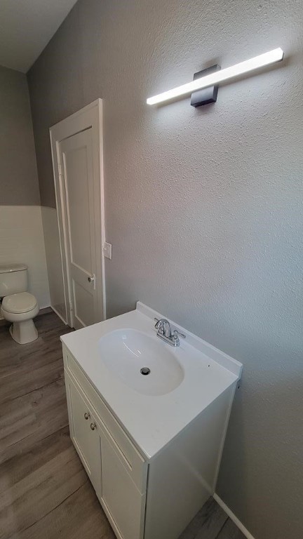 506 Ware St, Waycross, GA 31501 - bathroom featuring vanity and wood finished floors
