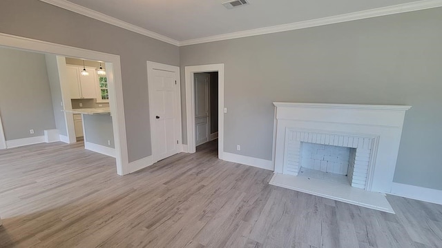 506 Ware St, Waycross, GA 31501 - unfurnished living room with light wood-type flooring, ornamental molding, and a fireplace