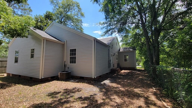 rear view of house with cooling unit