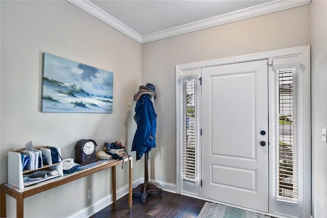 foyer entrance featuring a textured ceiling, crown molding, plenty of natural light, and dark wood-type flooring