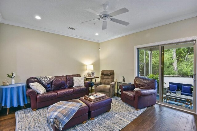 living room with ceiling fan, wood-type flooring, and ornamental molding