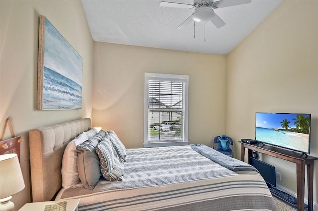 bedroom with ceiling fan and lofted ceiling