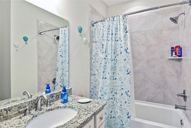 bathroom featuring shower / tub combo and vanity