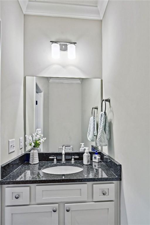 bathroom with vanity and crown molding