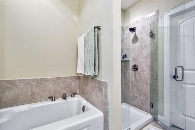 bathroom with shower with separate bathtub