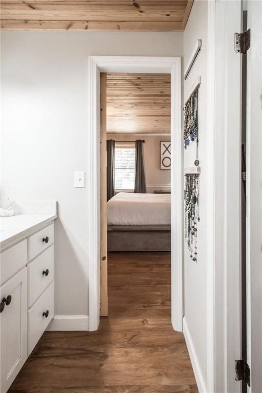 265 Traders Hill Rd, Folkston, GA 31537 - corridor featuring baseboards, dark wood-style flooring, and wooden ceiling