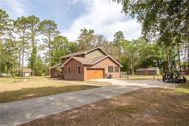 265 Traders Hill Rd, Folkston, GA 31537 - view of front of house with fence, a front yard, brick siding, and driveway